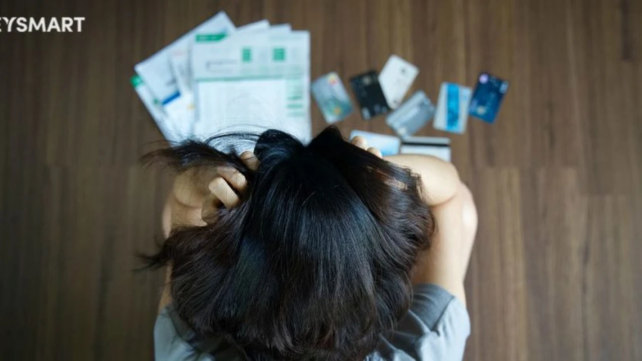 Close up on a plate of mashed potatoes, topped with baked pork chops with cream of mushroom soup, and a side of green beans.