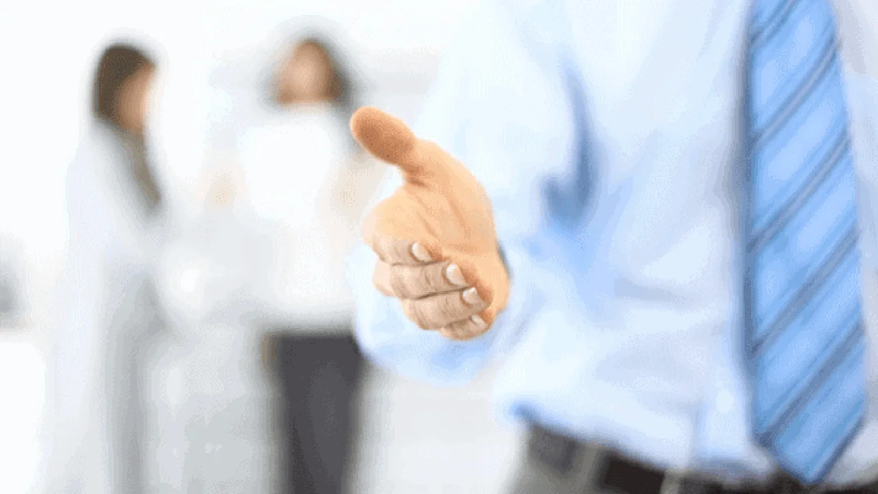 blue bowl of black bean beef tortilla soup on a board with cilantro and shredded cheese in background