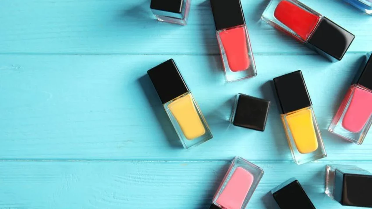 Close up on a plate of mashed potatoes, topped with baked pork chops with cream of mushroom soup, and a side of green beans.